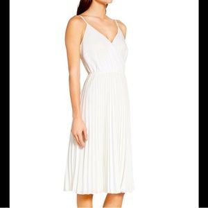 Ali & Jay white pleated “Lilly Pad” wrap dress